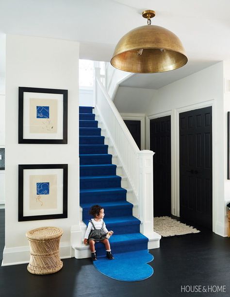 A bold sapphire stair runner with a puddle-like hem echoes the curves of the pendant overhead. | Photographer: Angus Fergusson | Designer: Montana Burnett Carpet Staircase, Stair Case, Carpet Stairs, Stair Runner, Staircase Design, House And Home Magazine, On The Floor, The Floor, Entryway Decor