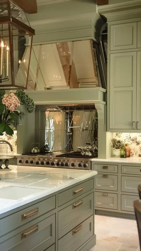 large kitchen, cozy, seren, sage green, island, mirror behind the stove, wallpaper Mirror Behind Stove In Kitchen, Sage Green Island, Beautiful Kitchen Ideas, Sage Kitchen, Feng Shui Rules, Kitchen Cozy, Green Island, Future House Ideas, Kitchen Design Plans