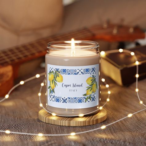 Capri Italy Candle, Italy Souvenir, Italy Gift for Her, Amalfi Coast Gift, Capri Souvenir, Scented Soy Candle, 9oz Packed with immersive aromas, these scented candles come in 9oz glass jars and are one size (2.8″ × 3.5") (7.1cm × 8.8cm). Made with 100% natural soy wax blend, each candle features a 100% cotton wick and a permanent adhesive label where your custom designs can come alive. .: Materials: 100% natural soy wax blend, 100% cotton wick and a glass jar .: One size: 2.8″ × 3.5" (7.1cm × 8.9cm) .: Burning time: 50-60 hours .: Glossy permanent adhesive label .: Choose from five different aromatic scents .: Assembled in the USA from globally sourced parts .: NB! All scents have the same wax color Capri Island, Italy Gift, Capri Italy, Scented Soy Candles, Amalfi Coast, Natural Soy Wax, Soy Candle, Glass Jar, Fragrance Candle