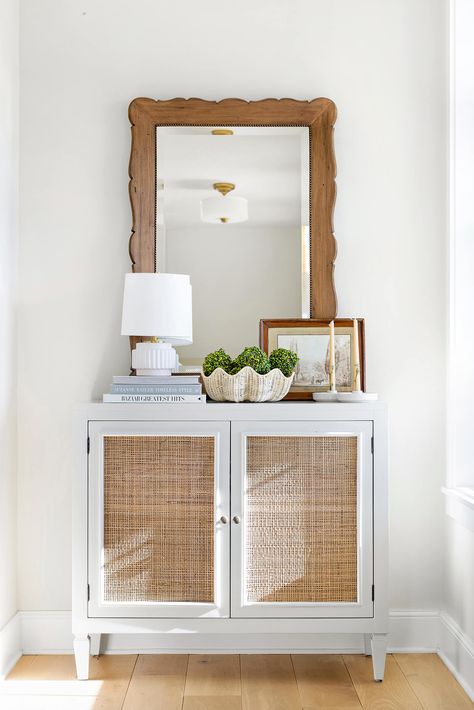 Featuring an open basket weave grass cloth cabinet front, this off-white cabinet with gold-finished knobs offers ample storage space. Our exclusive Santa Clara Chest was designed by Bria herself and is the perfect addition to any room. This piece provides ample internal storage with a shelf for all your essentials. This piece features a distressed finish. Cloth Cabinet, Off White Cabinets, Cabinet Fronts, White Cabinet, Kids Nightstand, Console Storage, Up House, Floral Pillows, Santa Clara