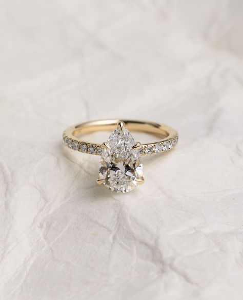 The PEAR-fect way to start your ring stack... with the Jordanna Pear Solitaire🤍⁠ ⁠ A pear-shaped diamond, also known as a teardrop diamond, combines the characteristics of a round and a marquise cut to create a unique and elegant gemstone shape with a single point and a rounded end✨💍⁠ ⁠ ⁠ Details:⁠ Jordanna Pear Solitaire⁠ with Pave & Hidden Halo 2.52ct | F | VS1 ⁠ Gold Engagement Rings Teardrop, Pear Cut Gold Engagement Ring, Engagement Rings Teardrop, Teardrop Diamond, Halo 2, Timeless Engagement Ring, Ring Inspo, Cute Engagement Rings, Future Engagement Rings