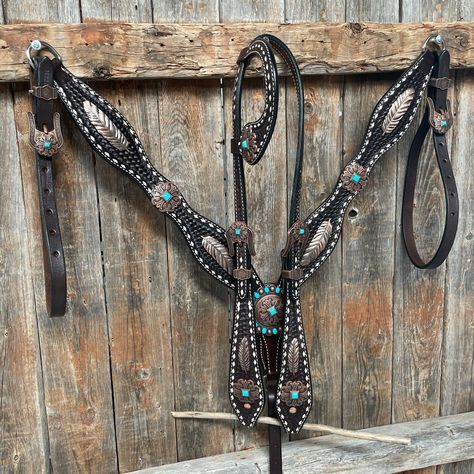 Browband, one ear and breastcollar is dark oil buckstitch style. They are decorated with copper feathers (W169) and turquoise fleur-de-lis western conchos and buckles (W141). Full Horse size Measurements Headstall measurements : bit to bit - 36" shortest setting : 44" longest settingBrowband measures 15" acrossBreastcollar measurements - From Center Ring to D Ring -16"Breastcollar including toggles : shortest settings - 26" : Longest settings -29" Buy Together or Separate BROWBAND ONLY - $244.00 Western Riding Tack, Western Tack Sets, Barrel Racing Tack Sets, Barrel Racing Tack Rodeo, Copper And Turquoise, Barrel Racing Tack, Country Things, Horse Things, Western Tack