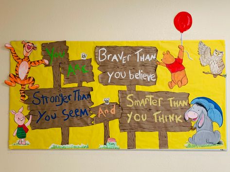 Simple happy bulletin board made from acrylic paint on poster board and brown paper from The Dollar Tree Winnie The Pooh Ra Bulletin Boards, Back To School Bulletin Boards Daycare, Daycare Bulletin Board Ideas, Winnie The Pooh Bulletin Board, Summer Bulletin Boards For Daycare, Winnie The Pooh Classroom Theme, Kindergarten Classroom Door, Bulletin Boards Elementary, Friends Bulletin Board