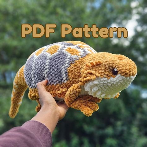 Upon buying this product, you will NOT get anything physical in the mail. You will receive a pdf to make your own plush.  Are you a beardie lover? This bearded dragon pattern is suitable for advanced-beginners to advanced crocheters! It works up to be a great gift, or the beardie in your life ♥️  You will need: *Premier Yarns Parfait Chunky in colors Mustard (MC; 2 skeins), Cream (C1; ½ skein), and Grey (C2, <¼ skein). *Polyester Filling *5mm Crochet Hook *Sewing needle *Stitch Marker You need to know: *How to sc in the round *How to decrease *How to crochet in rounds *How to change colors Crochet Bearded Dragon Pattern, Amigurumi Bearded Dragon, Bearded Dragon Crochet Pattern Free, Crochet Projects For Gifts, Bearded Dragon Crochet Pattern, Crochet Bearded Dragon, Bearded Dragon Crochet, Crochet For Bearded Dragon, Bearded Dragon Bead Pattern