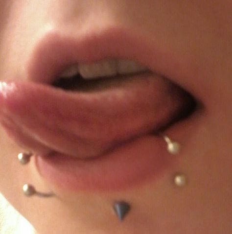 Switching things up today! I have a spiked, blue lip piercing in the middle and round-ball snake bites! Snake Bites Small Lips, Snake Bites And Labret, Snake Piercing Lip, Snake Bite Piercing Lips, Lip Piercings Spider Bites, Snake Bites Piercing Aesthetic, Spike Lip Piercing, Emo Snake Bites, Heavily Pierced