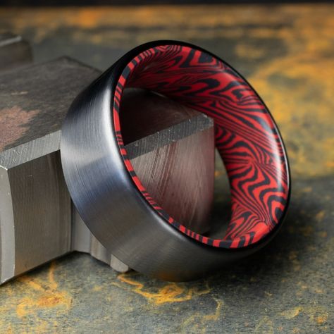 Striking Black Titanium Ring featuring a bold Black and Red Mosaic Spectrum Damascus inlay, finished with a sleek brushed texture. The perfect gift for men, whether for a wedding, anniversary, or special occasion. This men's wedding band combines modern design with timeless craftsmanship. The Blackening, Red Mosaic, Black Titanium Ring, Black Mosaic, Titanium Ring, Men's Wedding Ring, Ring Displays, Etsy Wedding Rings, Titanium Rings