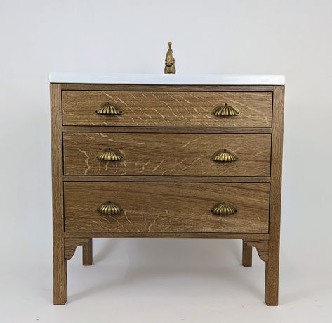 A simple yet stylish Oak 3 drawer bathroom vanity unit. (Tap, waste and overflow for illustration purposes). The basin forms part of the top so is included. Please note the top drawer is false fronted to allow for the basin. This is available with 3 different basin styles; Traditional; 1 tap hole (tap and waste for illustration only) Traditional; 3 tap holes (tap and waste for illustration only) Modern; 1 tap hole Handmade to order in our Brighton, UK workshop. Personalisation; Most selections c Small Vanity Unit Bathroom, Attic Ensuite, Drawer Bathroom Vanity, Small Vanity Unit, Oak Vanity, Oak Bathroom Vanity, Bathroom Vanity Unit, Modern Basin, Free Standing Vanity