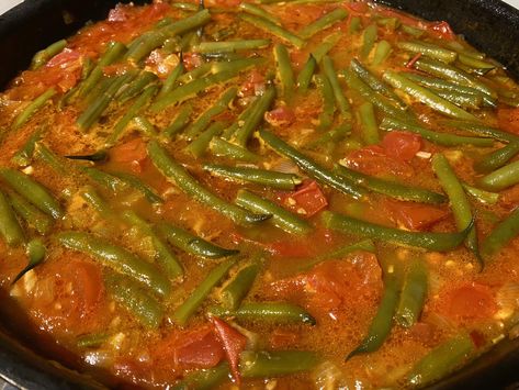 Green Beans in Tomato Sauce. Find the recipe https://www.whatscookingella.com/blog/green-beans-in-tomato-sauce Spicy Tomato Beans And Greens, Green Bean Tomatoes Recipes, Green Beans In Tomato Sauce Recipe, Green Beans With Tomato Sauce, Tomato Green Beans, Greek Green Beans With Tomatoes, Green Beans In Tomato Sauce, Green Beans With Tomatoes, Eating Around The World