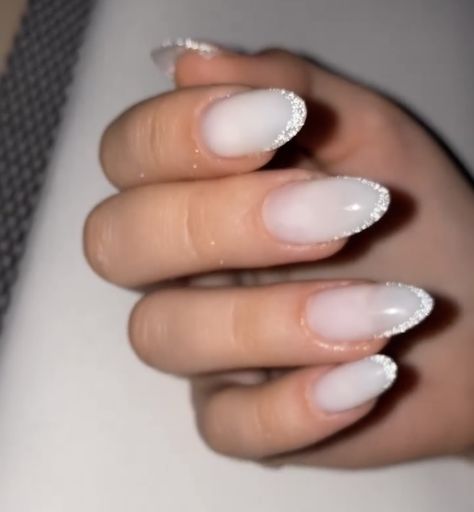 White Nails Glitter French, White Sparkle Almond Nails, White Sparkle French Tip Nails Almond, Colorful Engagement Nails, Oval Glitter French Tip Nails, Milky White Nails With Glitter Tips, Nails With Sparkle Tips, White French Tip Nails With Sparkles, White Glitter French Tip Nails Almond