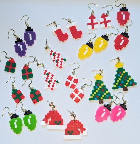 Get ready for the holidays with these cute and festive earrings. Made of mini perler beads fused together to create these beautiful earrings. They are light weight and super comfortable to wear all day or night. Melted Bead Earrings Diy, Stand Up Perler Bead Patterns, Perler Christmas Earrings, Perler Bead Christmas Earrings, Peeler Bead Earring Ideas, Christmas Perler Bead Earrings, Perler Earrings Diy, Mini Perler Bead Patterns Earrings, Thanksgiving Perler Beads