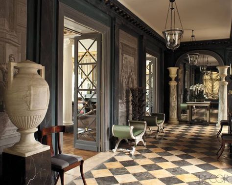 The Gilded Age-In the entrance hall, marble columns are topped with Medici vases, and a pair of 18th-century Swedish stools is upholstered in silk. Checkered Flooring, Marble Columns, Foyer Decorating, Parisian Apartment, غرفة ملابس, Paris Apartments, Gilded Age, Entry Way, World Of Interiors