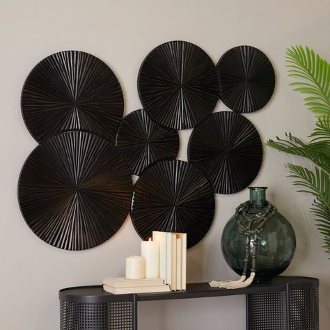 Add this wall decor to neutral or dark color background for a pop of color and texture. Create a balanced space in the most creative way with this expertly crafted wall décor for captivating focal point. An exceptional black round wooden sunburst wall decor that add a sleek and powerful appeal on any open wall space. This item ships in 1 carton. Can be hung horizontally using the sawtooths on the back; nails and screws not included. Suitable for indoor use only. This item ships fully assembled i Dark Color Background, Sunburst Wall Decor, Modern Wood Wall, Wall Decor Crafts, Plate Wall Decor, Open Wall, Wood Plate, Abstract Wall Decor, Wooden Wall Decor