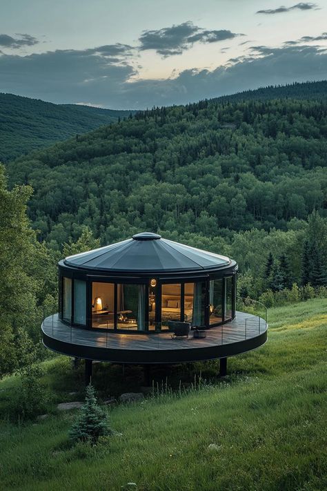 Prefab glass nad matte black steel round yurt on a large platform in a green valley. Check out all of these innovative and stylish prefab homes that bring modern designs to life. This is the future of cheap and sustainable living! Modern Glamping House, Yurt Home Ideas, Yurt Platform, Large Tiny House, Modern Yurt, Yurt Cabin, Sustainable House Design, Glamping Pods, Pod House