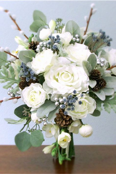 Another winter floral arrangement might be timeless for your big day. Speaking from experience, this bouquet will complement any winter ceremony. Pin this inspiration to your bridal floral collection. Winter Bridal Shower Decorations, Bridal Shower Decorations Purple, Bridal Shower Question Game, Winter Ceremony, Bridal Shower Favors Diy, Ear Ideas, Silk Flower Wedding, Silk Flower Wedding Bouquet, Purple Centerpieces