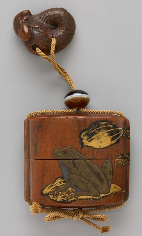 Japanese Case (Inrō) with Design of Frogs. Edo period. 19th century. Case: powdered gold (maki-e) and colored lacquer on black lacquer; Fastener (ojime): stone; Toggle (netsuke): wood carved in the shape of a mermaid. The Metropolitan Museum of Art. Japanese Frog Art, Japanese Wood Carving, Japanese Frog, Japanese Inro, Japanese Swords, It's Wednesday, Asian Love, Frog Art, Edo Period