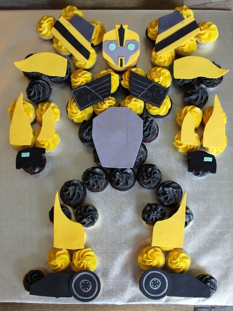 Transformer's Bumblebee cupcake cake with mini cupcakes and a standard cupcake for the head. by Kaylin Jones Transformers Cupcakes, Transformers Birthday Cake, Bumblebee Birthday, Rescue Bots Birthday, Transformers Party, Transformers Cake, Transformers Birthday Parties, Transformers Birthday, Transformer Party