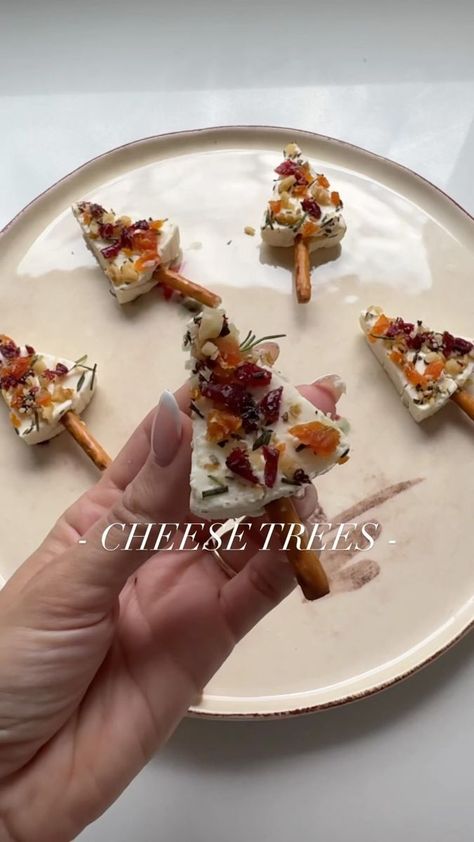 63K views · 4K reactions | DETAILS HERE ⬇️✨ An easy appetizer that guests will love this holiday season- Christmas TREES made of cheese 🎄🧀 What you’ll need: 🧀 triangle cheese (I used @thelaughingcowusa) 🧀 dried cranberries 🧀 dried apricots 🧀 walnuts 🧀 fresh rosemary 🧀 pretzel sticks Finely chop or use a food processor to cut your dried fruit, rosemary and walnuts. Mix together and place one side of your cheese into the mixture. Stick in your pretzel stick and ENJOY🎄🧀 SAVE to recreate these for your holiday get togethers and tag me in your creations 🧀🎄 • • #foodie #eeeeeats #wineandcheese #foodandwine #entertainingathome #dinnerparty #appetizers #easyrecipes #holidayparty #dinnerpartyideas #cheese #holidayrecipes #christmasfood #christmas #christmasparty #cheeseboard #easyappet Christmas Cheese Tree, Charcuterie Lunch, Cheese Triangles, Christmas Charcuterie, Christmas Yummies, Christmas Cheese, Cheese Wine, Wedding Appetizers, Wine And Cheese Party