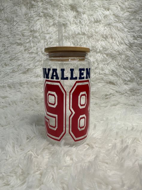 98 Braves Wallen Glass Can - 16 ounces! Perfect for all Morgan Wallen lovers!! Best for iced beverages. Design is made with high quality permanent vinyl. Design colors: navy and red **HANDWASH ONLY** All cups come with a bamboo lid and straw. Morgan Wallen Stuff, Morgan Wallen Lyrics Wallpaper, 98 Braves, Lane Frost, Neyland Stadium, Iced Beverages, Trendy Water Bottles, Best Country Singers, Horse Shop