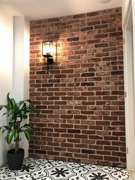 Brick slip wall with Paris tiles & wall light. Brick Slip Wall, Brick Tv Wall Ideas, Indoor Brick Wall Ideas, Brick Shower Wall, Removable Wall Panels, Pillar In Living Room, Brick Wall Interior Living Room, Brick Tiles Bathroom, Reclaimed Brick Wall