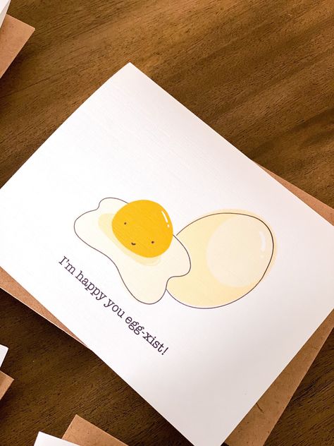 "This adorable pun greeting card will make you smile! \"I'm Happy You Egg-xist\". There is also A pack of 5 cards that include cute sayings like \"Can You Moo-ve Closer?\", \"Missing You Pig Time\", \"Just Bee-Cause\", \"Hey Cutie Pabooty\", or \"I'm Happy You Egg-xist\". Listed in my Etsy Shop! - Free shipping on all Paintedwaterworks orders $20 and over! They do not have to be the same card! If your purchase from my Etsy store is $20 or more, you will get free shipping!  Each card comes with a Cheesy Valentines Cards Puns, Corny Cards For Boyfriend, Cards Just Because, Valentines Cards Handmade For Friends, Animal Pun Cards, Fun Greeting Cards, Cute Greeting Card Ideas, Pun Valentines Day Cards, Valentines Day Card For Friends