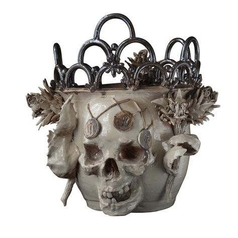 Whether adding a unique gothic accent to a side table or simply celebrating Halloween, this vase hits the nail on the head. Featuring a three-dimensional skull, the glazed ceramic vase is accented with thistles on both sides and topped with metallic rings. The vase is extremely delicate, be cautious when moving and dusting it. Gothic Vase, Skull Vase, Steampunk Mask, Unique Objects, Visual Search, Decorative Vases, Vase Crafts, Keramik Vase, Glazed Ceramic