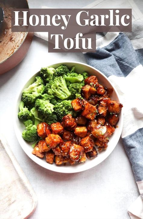 This quick honey garlic tofu dish is ready in just 30 minutes. Enjoy a simple and satisfying vegetarian dinner with tofu fried to perfection and tossed in a flavorful honey garlic sauce. Pair it with rice and broccoli for a delightful meal. Dinner With Tofu, Honey Garlic Tofu, Tofu Fried, Garlic Tofu, Rice And Broccoli, Chuck Roast Recipes, Honey Garlic Sauce, Tofu Dishes, Fried Tofu