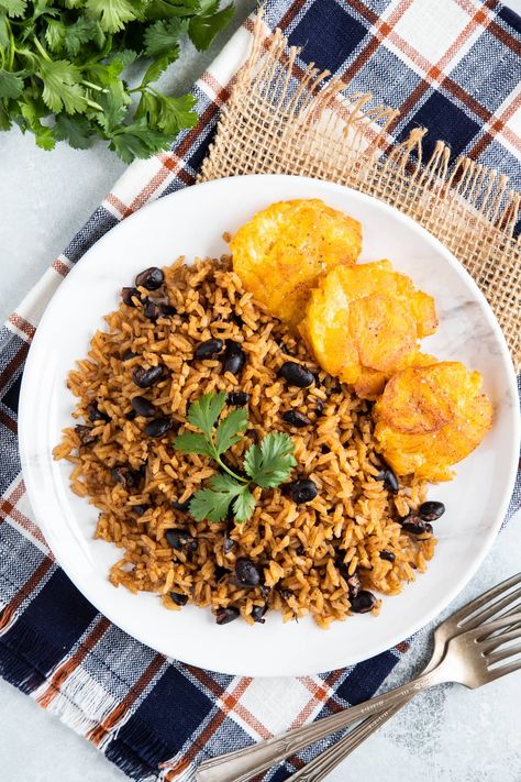 Black beans and rice aka Arroz Congri is a classic Hispanic dish that's also a good source of proteins. Learn how to make it here. Black Beans And Rice Recipe, Hispanic Dishes, Slow Cooker Pork Roast, Cilantro Chicken, Black Beans And Rice, Cooking Dried Beans, Pork Shoulder Roast, Slow Cooker Roast, Beans And Rice