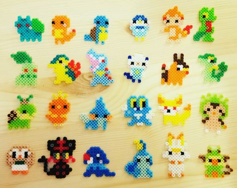 Hand made tiny perler pokemon charms Chikorita Perler Beads, Perler Beads Charms, Tiny Hama Bead Designs, Small Pokemon Perler Bead Patterns, Pixel Perler Beads, Peeler Bead Pokémon, Perler Pokemon Pattern, Pokemon Aquabeads, Cute Tiny Perler Bead Patterns