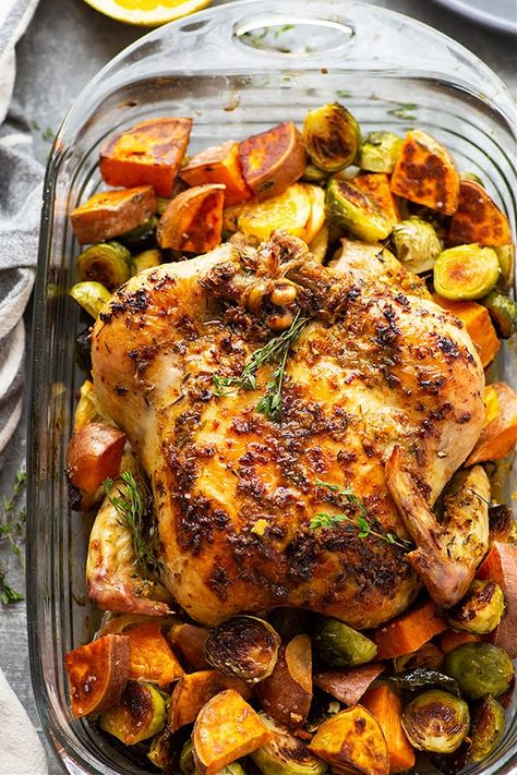 Roasted with a ginger orange butter and served with tender sweet potatoes and brussels sprouts, this orange roast chicken is a simple, yet impressive way to make roast chicken for a holiday dinner! Roast Chicken With Vegetables, Chicken Varieties, Roast Chicken And Potatoes, Holiday Chicken, Creative Cookery, Chicken With Sweet Potatoes, Thanksgiving Chicken, Whole Baked Chicken, Sprouting Sweet Potatoes