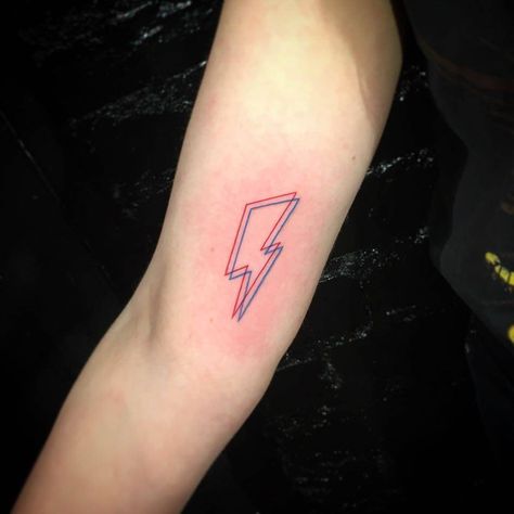 David Bowie's bolt anaglyph tattoo on the right inner arm. Anaglyph Tattoo, David Bowie Tattoo, Small Wave Tattoo, Lightning Bolt Tattoo, 42 Tattoo, Lightning Tattoo, Bolt Tattoo, 4 Tattoo, Waves Tattoo