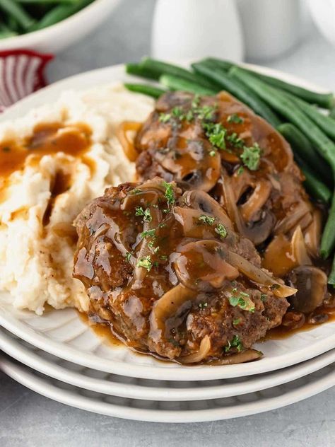 This Old Fashioned Salisbury Steak Recipe is an easy skillet dinner made with ground chuck, bread crumbs and flavorful spices in a rich brown gravy! Old Fashioned Salisbury Steak Recipe, Smothered Cabbage, Best Salisbury Steak Recipe, French Coconut Pie, Cabbage Potatoes, Homemade Salisbury Steak, Hamburger Recipes Patty, Easy Skillet Dinner, Ground Chuck