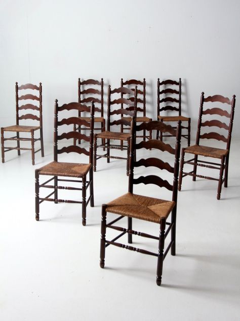 "This is a set of eight Tell City Chair Company chairs circa 1924 - 1943.  The tall ladder back chairs feature hand-woven rush seats.  A beautiful collection of dining chairs.   CONDITION In good condition with wear consistent with age and use. Patina and scuffs from natural usage.  MEASUREMENTS Height:              40\"     ...        101.6 cm Depth:               18\"      ...       45.7 cm Width:               18\"   ...       45.7 cm Seat Height:     18\"   ...       45.7 cm SHIPPING Standar Antique Ladder, Tall Ladder, Ladder Chair, Ladder Back Dining Chairs, Vintage Ladder, Ladder Back Chairs, Rustic Chair, Dining Chairs Set, Wood End Tables