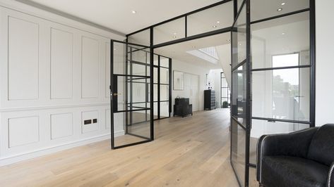 The dark crittall screens contrasting well with the wall panelling. Crittal Doors, Crittal Windows, Greige Design, Metal Windows, Internal Glass Doors, Steel Door Design, Steel Windows, Glass Doors Interior, Georgian Homes