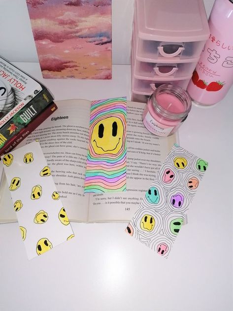 A set of 3 unique smiley face high quality book marks, available in my Etsy store. This makes a perfect present for book lovers of all ages or treat yourself to some adorable bookmarks to put in your favourite reads!#bookmarks #stationary #christmasgifts #originalart #colourfulart #etsystore #handmade #cutestationary #smileyfaces #trippy Smiley Face Bookmark, Trippy Bookmarks, Drawn Bookmarks, Aesthetic Smiley Face, Aesthetic Trippy, Stationary Gifts, Book Marks, Cute Stationary, Custom Drawing