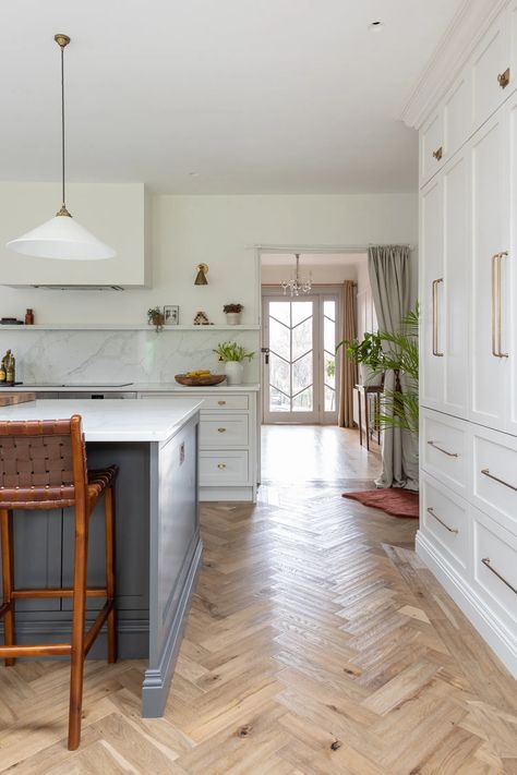 Chevron Kitchen Floor, Herringbone Wood Floor Kitchen, Herringbone Kitchen Floor, Herringbone Floor Kitchen, Spanish Modern Kitchen, Off White Kitchen Cabinets, Dining Extension, Utility Space, Herringbone Floors