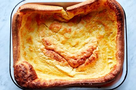 Classic Yorkshire pudding is the combination of a few humble ingredients—eggs, milk and flour—bolstered by the savory drippings from a large beef roast The recipe is simple, and relies upon just a few ingredients whisked together in a bowl then baked at a high temperature to achieve puffy, golden-brown perfection (Yorkshire pudding also happens to serve as a perfect accompaniment to said roast.) If you don’t have roast drippings, or run short on them, or are serving vegetarians, the recipe can Giant Yorkshire Pudding Recipe, Yorkshire Pudding Recipe, Yorkshire Pudding Recipes, Yorkshire Pudding, Nyt Cooking, Pudding Recipe, Roasted Carrots, Roast Beef, Pudding Recipes