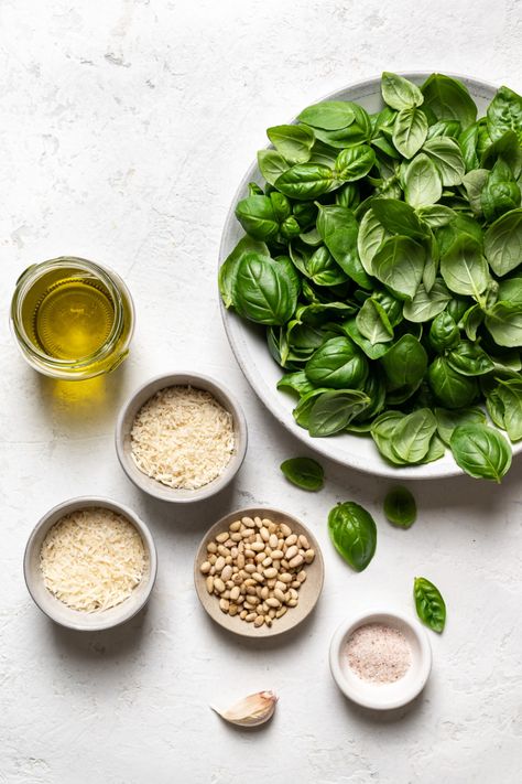 This classic, luxuriously creamy Pesto Alla Genovese (Basil pesto) is made from a bounty of fresh basil, pine nuts, garlic, olive oil and cheese. Vibrant in colour and flavour, it will be the brightest-tasting pesto you’ve ever made or eaten. Genovese Basil, Italian Deli, Basil Plant, Creamy Pesto, How To Make Pesto, Garlic Olive Oil, Milk And Cheese, Basil Pesto, Basil Leaves