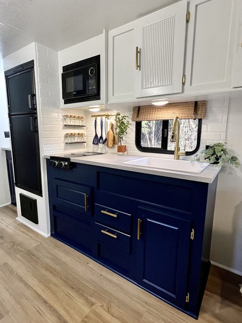 Revamped Travel Trailer Navy Blue Rv Cabinets, Rv Blue Cabinets, Navy Caravan Interior, Navy Blue Camper Interior, Pole Wrap Cabinet, Ikea Countertop, Camper Projects, Bus Homes, Rv Updates