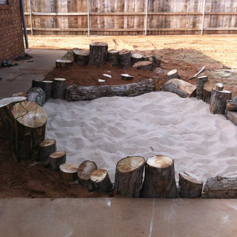 My very own sandbox and digging pit with wood stump border that also serves as a climbing beam. Backyard Dog Area, Natural Play Spaces, Outdoor Play Space, Play Area Backyard, Outdoor Play Spaces, Family Day Care, Sand Pit, Outdoor Play Areas, Kids Outdoor Play