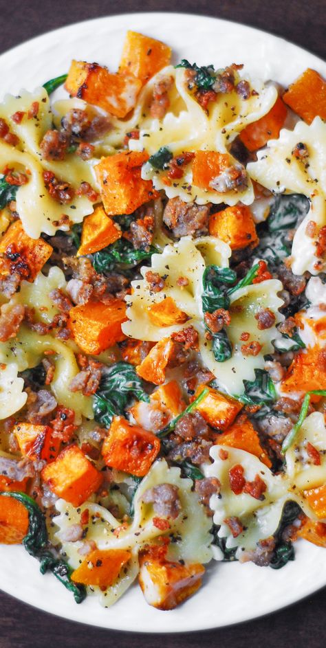 Creamy Butternut Squash Pasta with Sausage and Spinach is a perfect Autumn comfort food. This easy and flavorful recipe is packed with veggies and will become your favorite Fall and Winter family weeknight dinner! #butternutsquash #butternutsquashpasta #butternutsquashrecipes #bowtie #bowtiepasta Butternut Squash Pasta With Sausage, Pasta With Sausage And Spinach, Creamy Butternut Squash Pasta, Butternut Squash Recipes Pasta, Squash Pasta Recipe, Sausage And Spinach, Creamy Butternut Squash, Pasta With Sausage, Butternut Squash Pasta