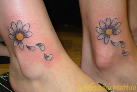 I really like the idea, with the petals falling, but not so much the execution. Daisy Tattoos, Petals Falling, Daisy Flower Tattoos, Sunflower Tattoo Sleeve, Photography Videos, Flower Tattoo Back, Foot Tattoos For Women, Tattoos For Women Flowers, Daisy Tattoo