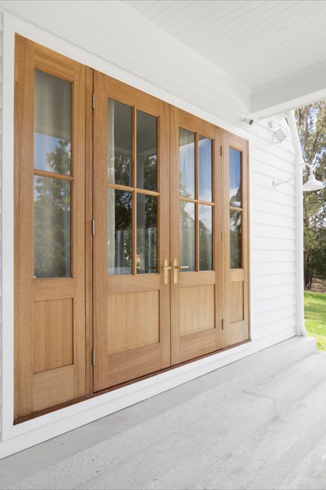 The Tradco Menton Lever in Satin Brass complements the double timber doors beautifully, adding a touch of contemporary elegance to their design. Together, they create a cohesive and stylish entrance that enhances the overall aesthetic of the space. Timber Front Door Entrance, Front Door Styles Entrance, Double Door Design Entrance, Wood Double Front Door, Double Front Door Ideas, Double Wood Front Doors, Timber Front Door, Mahogany Front Door, Double Front Entry Doors