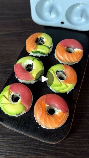 1.3K reactions · 260 shares | Sushi Donuts 🌟😍 
 
Ingredients: 
🍣Lightly salted salmon/trout 
🍣Tuna 
🍣Avocado 
🍣Cucumber 
🍣Cream cheese 
🍣Nori chips 
🍚Boiled rice (200 g. raw) 
🍚Rice vinegar: 40 ml. 
🍚Salt: 1/2 tsp. 
🍚Sugar: 1 tsp. 
Preparation: 
🍣Mix the boiled rice with rice vinegar, salt and sugar, let it cool, stirring occasionally. 
🍣In a donut mold, place the salmon, avocado, tuna and cucumber, then place the cheese and nori chips, and top with the rice. Then flip the mold, dip in soy sauce and enjoy ☺️ Bon appétit!!  
 
( By: @chef_dmitriy_official ) 🫶🏻 Thank you  
 
. 
. 
. 
. 
#easyrecipe #lunchidea #dinneridea #recipeinspiration #sushirecipe #sushi #easyssushi #sushibdonuts #sushihomemade #seafood #salmon #tuna | Goodies Channel Sushi Donut Recipe, Sushi Birthday Party Ideas, Tuna And Cucumber, Sushi Birthday Party, Nori Chips, Sushi Donut, Sushi Cakes, Salted Salmon, Sushi Birthday