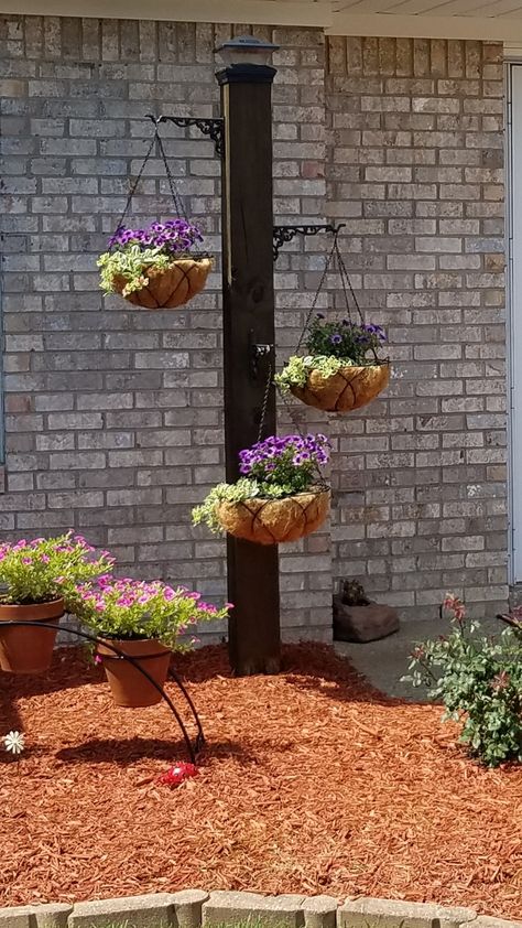 6x6 flower post with solar cap light I made.  It was my mom's idea.  I love it!!! Solar Flower Garden, 4x4 Hanging Basket Post, Yard Post Ideas, 6x6 Post Ideas Projects, Flower Pot Light Post, Hanging Basket Post, 4x4 Post Projects, 6x6 Post Ideas, Post With Flowers