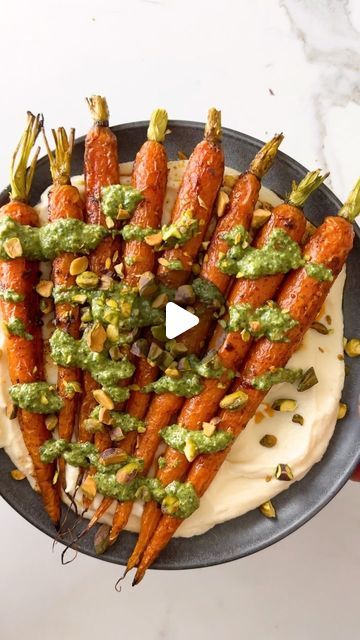 Erin Clarke | Easy Healthy Recipes on Instagram: "Don’t toss your carrot tops!🥕 Turn them into pesto for Roasted Carrots with Whipped Ricotta. This gorgeous side dish tastes delicious warm or room temperature. It’s the perfect Easter recipe and makes veggies exciting!  YOU’LL NEED -1 lb carrots with their tops -2 T extra-virgin olive oil -1 tsp kosher salt, divided -1/4 tsp ground black pepper -1 tsp paprika -1/2 tsp red pepper flakes -1 c whole milk ricotta cheese -1 T maple syrup or honey -1/4 c roasted pistachios or pine nuts  Carrot Top Pesto: -1 c loosely roughly chopped carrot tops, tough stems removed (from carrots above) -1 1/2 c tightly packed fresh basil -1/3 c walnuts, pine nuts, pistachios, or cashews -2 T lemon juice -1 large clove garlic, peeled -3/4 tsp kosher salt -1/2 c e Carrot Top Pesto, Roasted Pistachios, Carrot Tops, Whipped Ricotta, Honey Glazed Carrots, Easter Recipe, Carrot Top, Glazed Carrots, Roasted Carrots