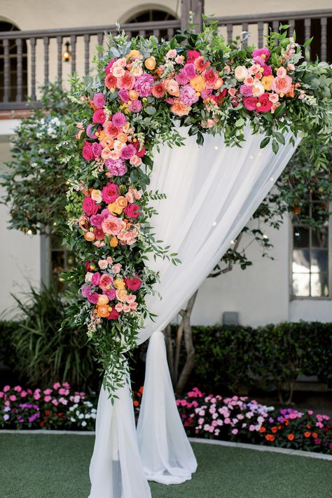 Bright Wedding Aisle Flowers, Wedding Coordinator Outfit Ideas, Sage Green Bridesmaid Dresses Bright Flowers, Bright Pink And Orange Wedding Flowers, Multicolor Wedding Decor, Bright Floral Wedding Arch, Pink And Orange Wedding Arch, Pink And Orange Wedding Decor, Bright Pink Wedding Flowers