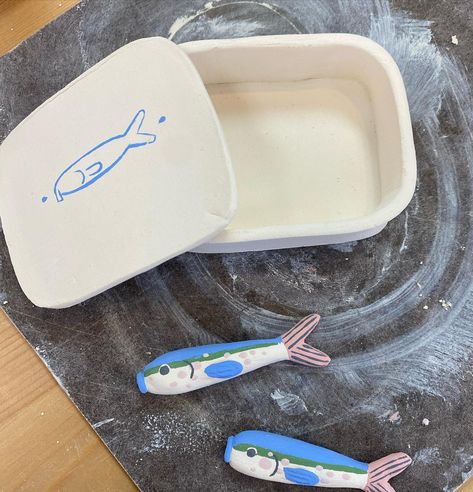 If you have been to the studio in the past couple weeks, chances are I’ve made you go look at the clay “can” of sardines made by this artist. Isabel is a local school art teacher, and comes up with the most creative projects! These still need a final firing for glaze-but I couldn’t wait to share! Can Of Sardines, Sardine Can, Pottery Ideas, Clay Ideas, School Art, Art Teacher, Creative Projects, Art School, The Studio