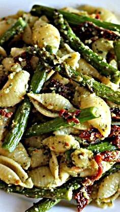 Pesto Pasta with Sun Dried Tomatoes and Roasted Asparagus A quick and easy dish for those busy weeknights, and it is chockfull of veggies! - Pesto Pasta with Sun Dried Tomatoes and Roasted Asparagus/Delicious. I used whole wheat shells, store bought pesto and shredded mozarella. I also cut the asparagus in pieces before I roasted it. The fried egg on the top was awesome.Will make again. #pestopasta Pasta With Sun Dried Tomatoes, Resep Pasta, Resep Salad, Asparagus Recipes, Sundried Tomatoes, Store Pictures, Salad Pasta, Roasted Asparagus, God Mat