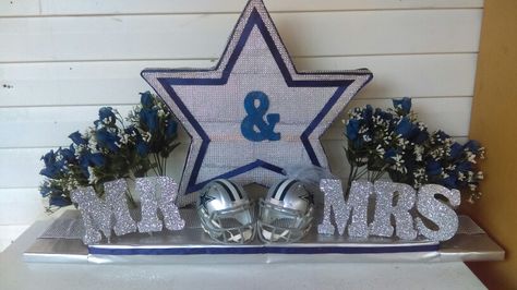 Dallas cowboy theme wedding What you need styrofoam, jewel ribbon letters glitter flowers 2 helmets, blue ribbon an syilver wraping paper! Dallas Cowboy Wedding Theme Ideas, Dallas Cowboys Wedding Theme, Cowboy Theme Wedding, Cowboy Wedding Theme, Cowboy Wedding Decorations, Ribbon Letters, Cowboy Weddings, Dallas Cowboys Wedding, Dallas Cowboys Theme