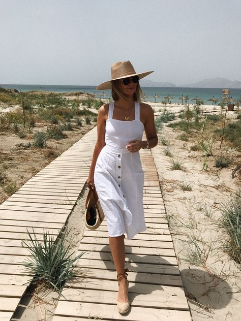 Emma Hill wears white Summer linen dress, straw fedora hat, wedge espadrilles, gold layered necklaces, straw Loewe bag. Chic summer style. Style Parisienne, White Dress Summer, Outfits With Hats, Mode Inspo, White Summer, White Outfits, Summer Hats, Women's Summer Fashion, Spring Summer Outfits